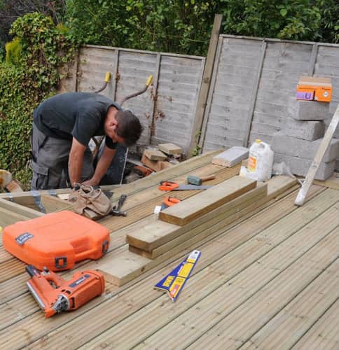 man fitting a deck - LSK Building Westbury, Warminster and Trowbridge