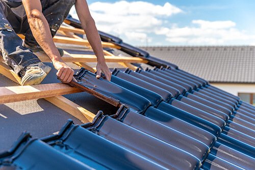 Roofer laying tiles - LSK Building Westbury, Warminster and Trowbridge